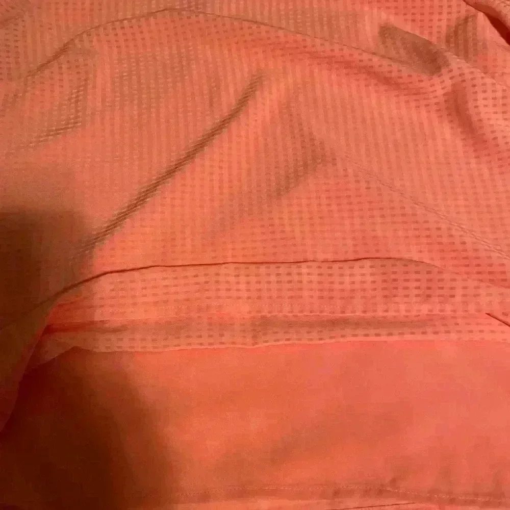Cece beautiful peach blouse. This blouse has bell sleeves with tie closures. - Picture 7 of 7